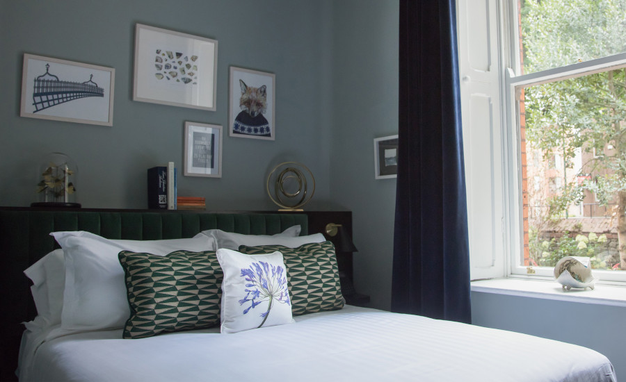 Stylish double room, framed pictured and window view at Wilder Townhouse