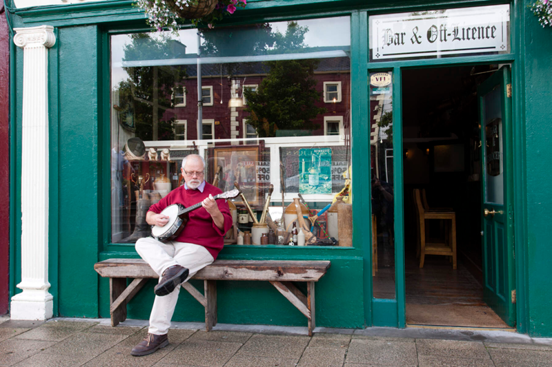 Traditional musician outside a bar