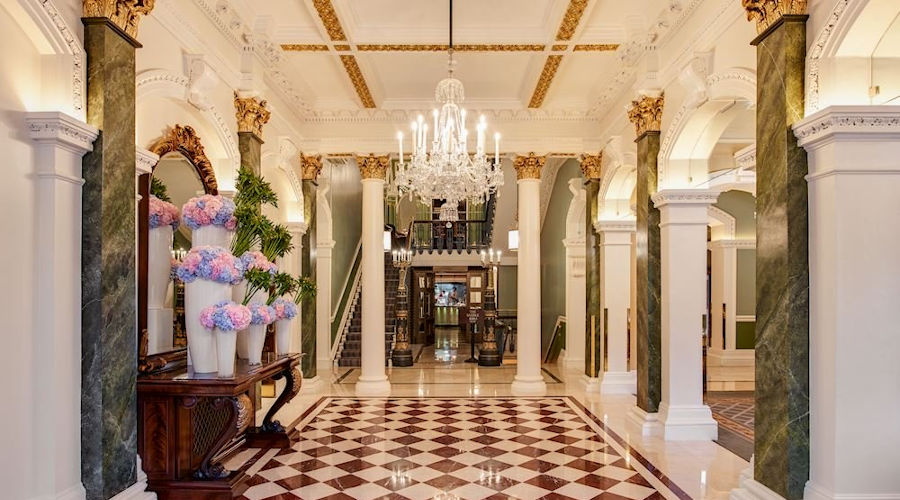 Richly decorated lobby of Shelbourne Hotel with marble and chandeliers