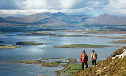 Couple looking at view of Clew Bay and Croagh Patrick