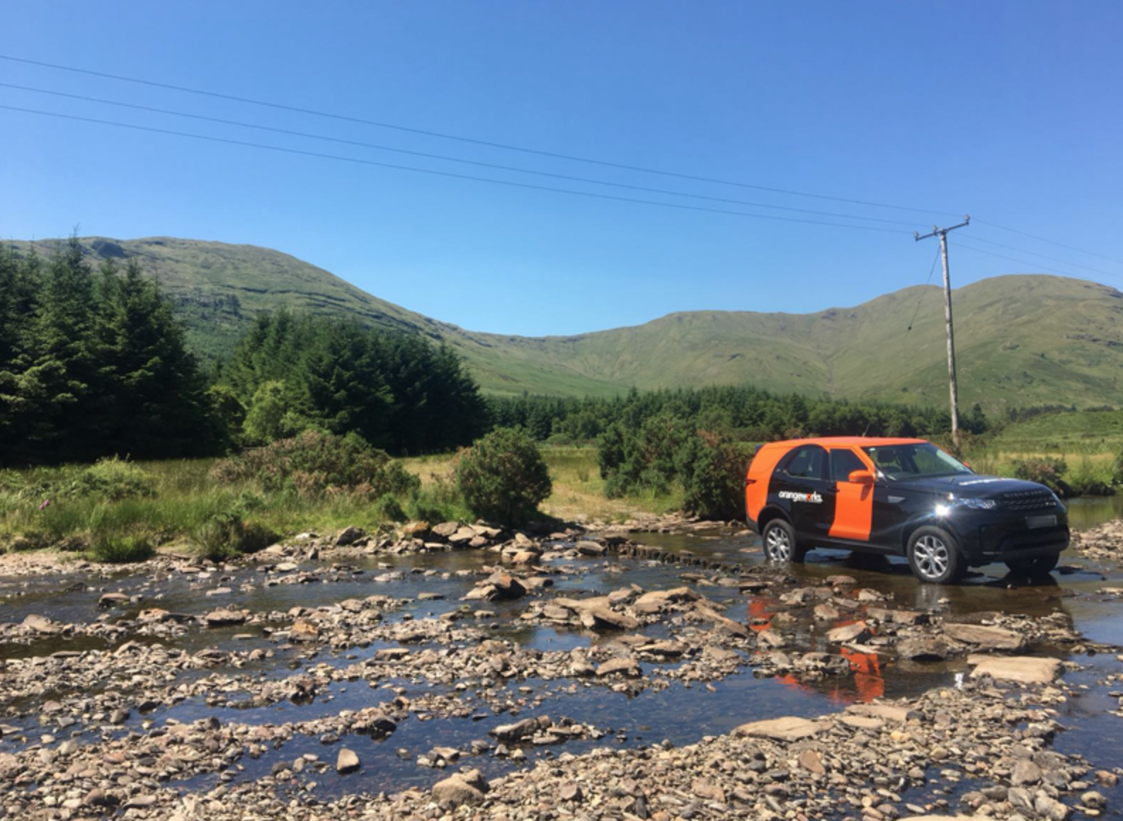 The steep Cliffs of Moher stretch off into the distance, with the sea beneath them