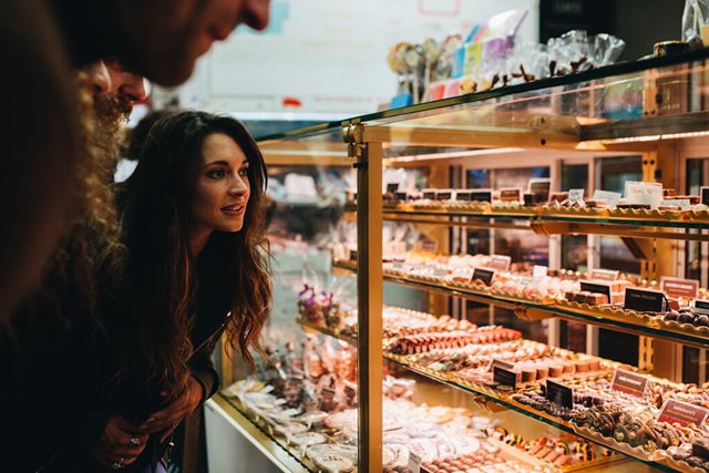 Woman admires chocolate display in the English Market