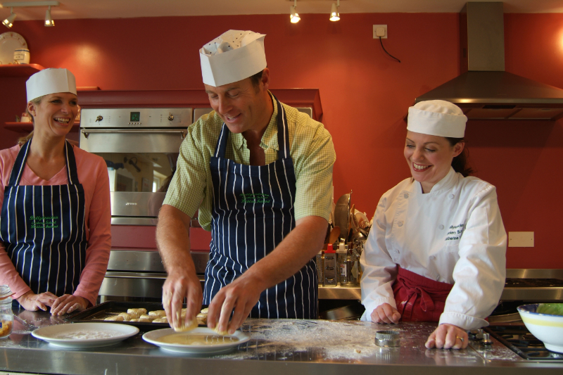 Image of a chef teaching two students at Ballyknocken cookery school
