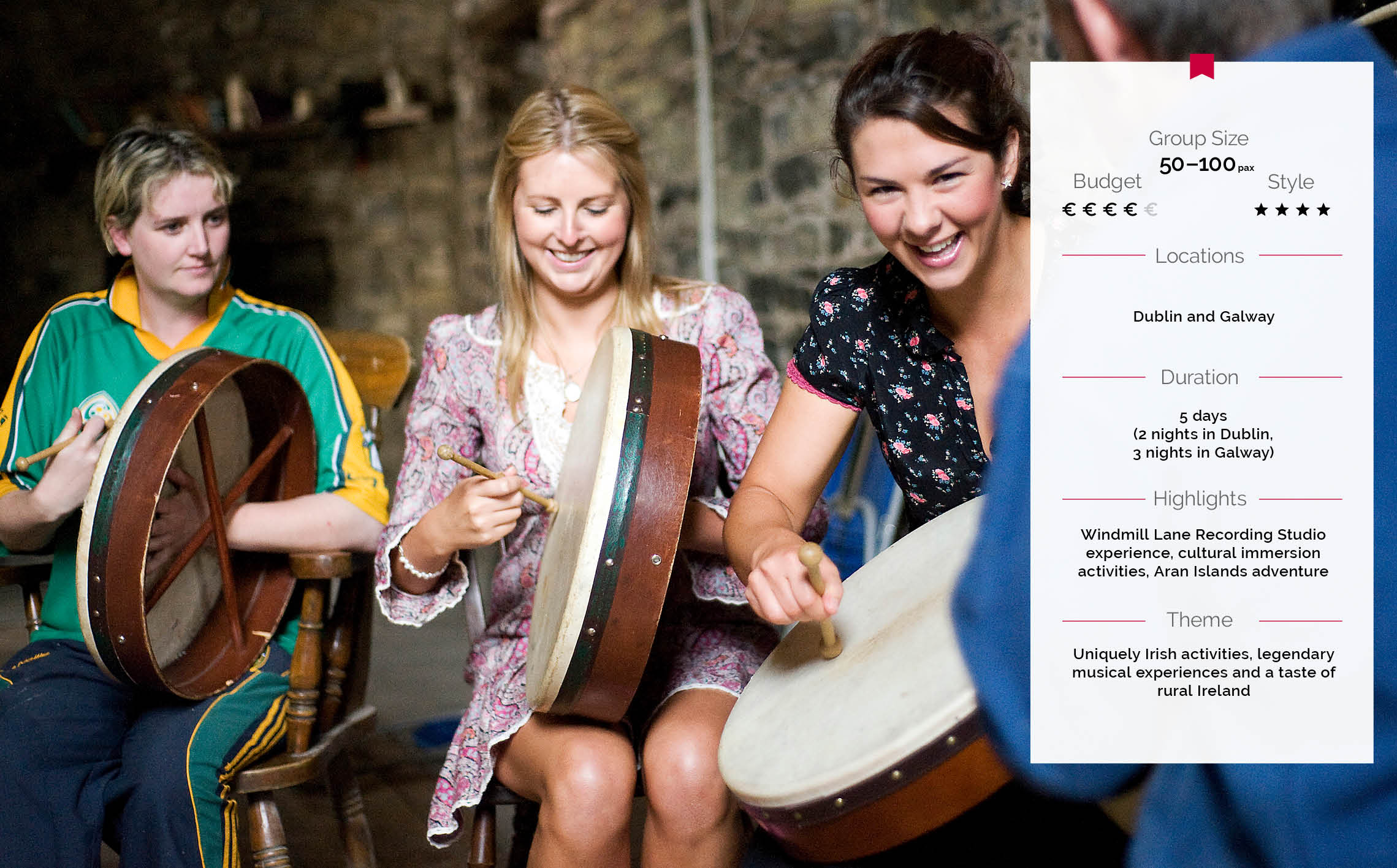 Delegates laugh as they take part in a bodhrán (traditional Irish Drum) lesson