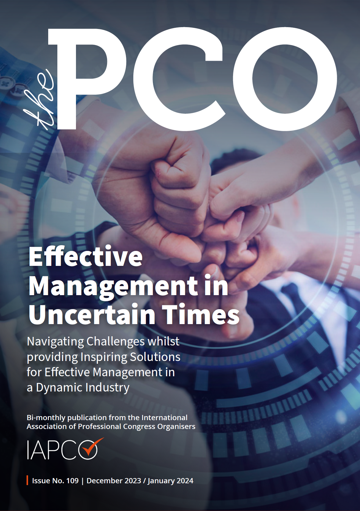 Cover of 'The PCO' magazine, December 2023/January 2024 edition, titled 'Effective Management in Uncertain Times,' featuring a close-up of a team joining fists in a gesture of unity and collaboration