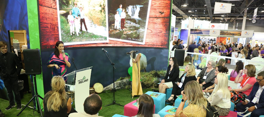 Woman with microphone telling story to crowd