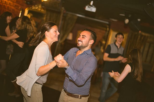Two people dancing in a pub
