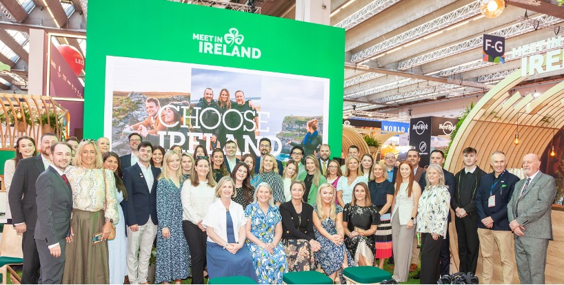 IMEX Conference in Frankfurt with a group of people taking a photo at a meet in ireland stand