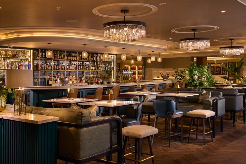 Elegant and modern Sally Gap Bar at Powerscourt Hotel, featuring chic lighting, comfortable seating and a well-stocked bar