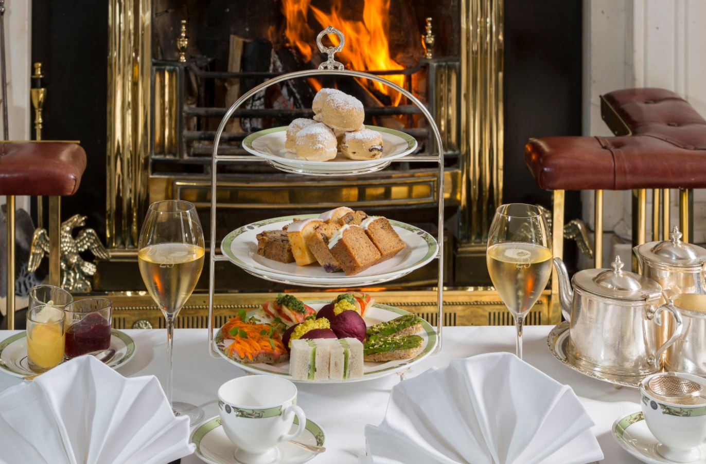 Two women admire a book on display in Trinity College's vast library