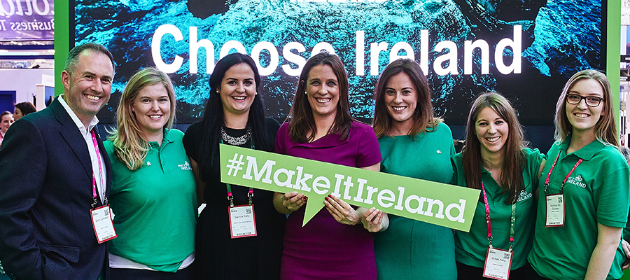 The Meet in Ireland team at IMEX America, holding a #MakeItIreland sign