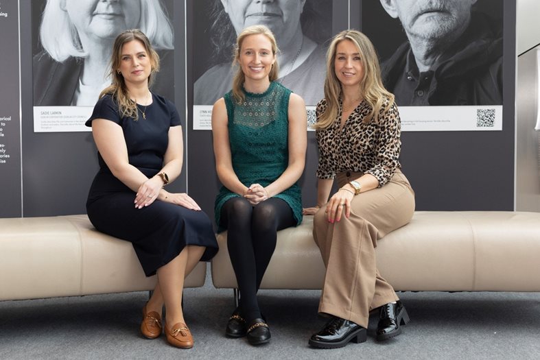 Three women sitting on a sofa at the International Social Housing Festival in Dublin June 2025