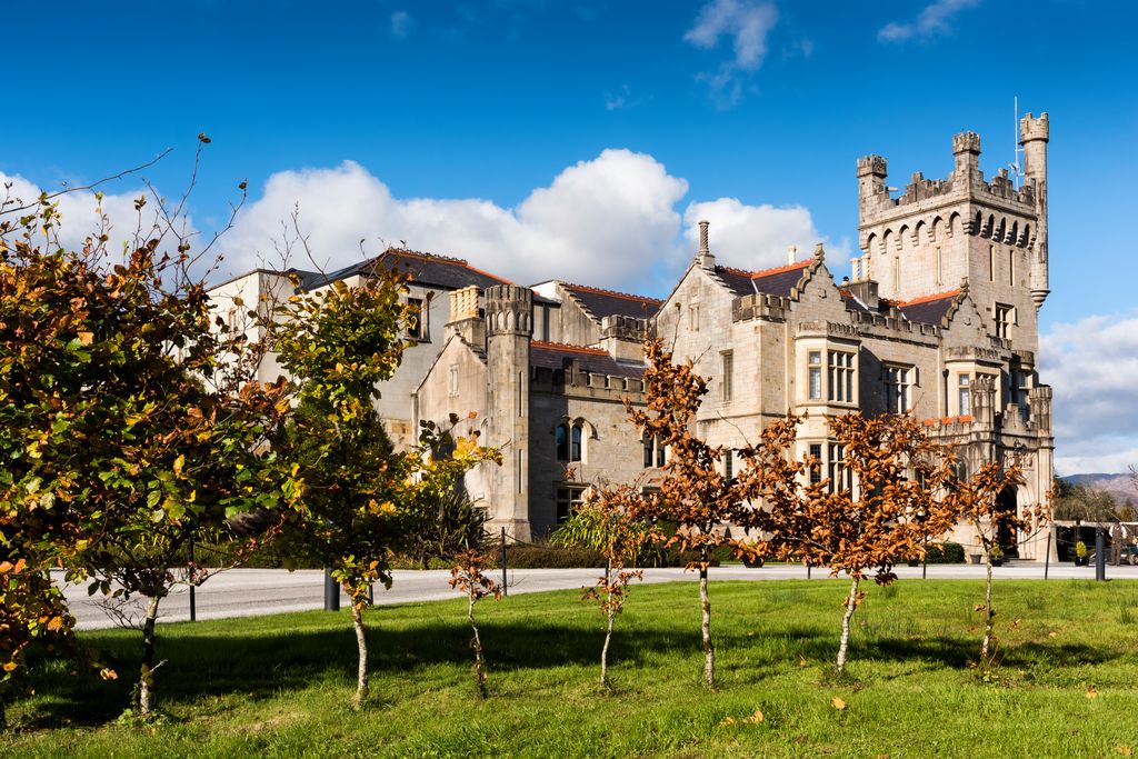 Large stately home in front of blue sky