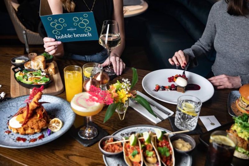 Delicious spread at The Morgan's Bubble Brunch, featuring a variety of gourmet dishes, cocktails and desserts
