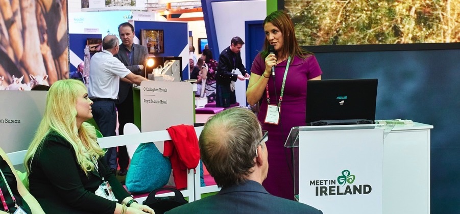 Meet in Ireland team member delivering a presentation at a trade event
